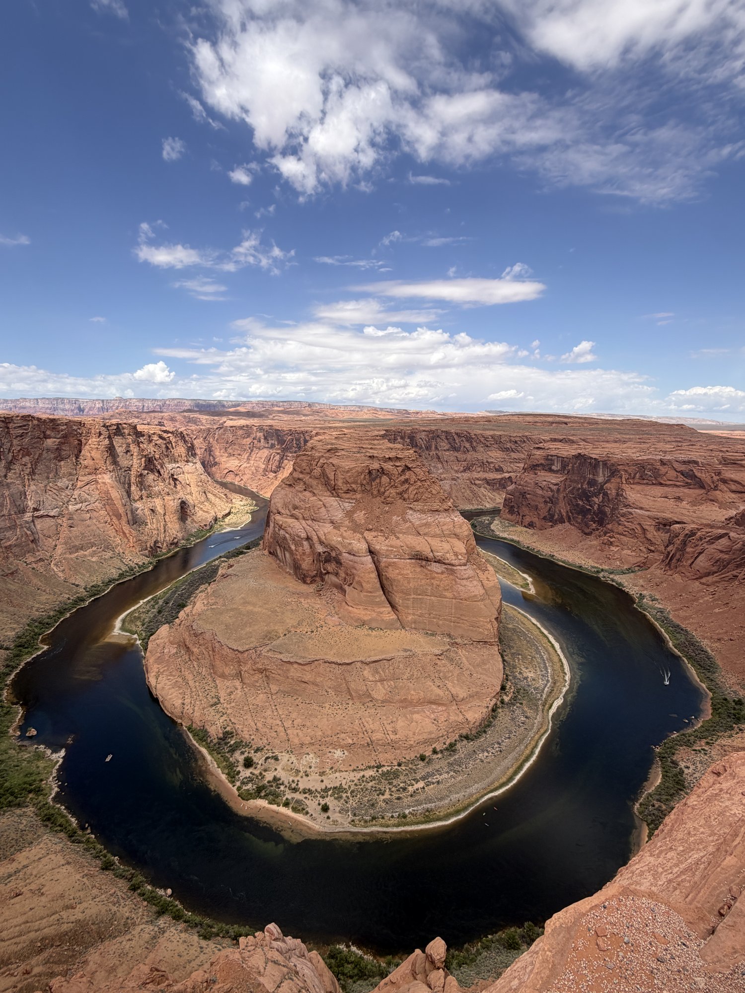 The Colorado River curving around a sandstone pillar at Horseshoe Bend