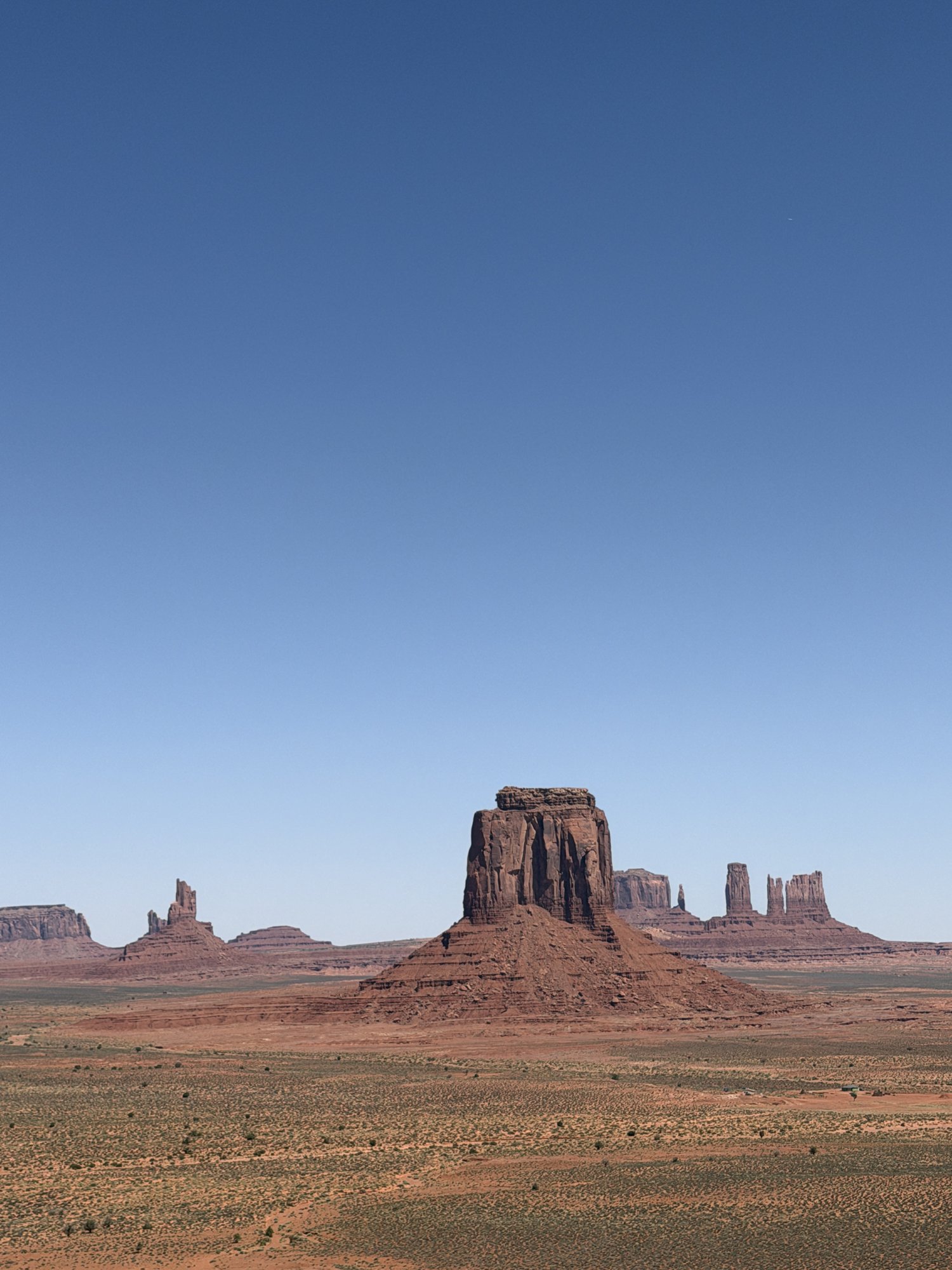 The red buttes of Monument Valley under a clear sky