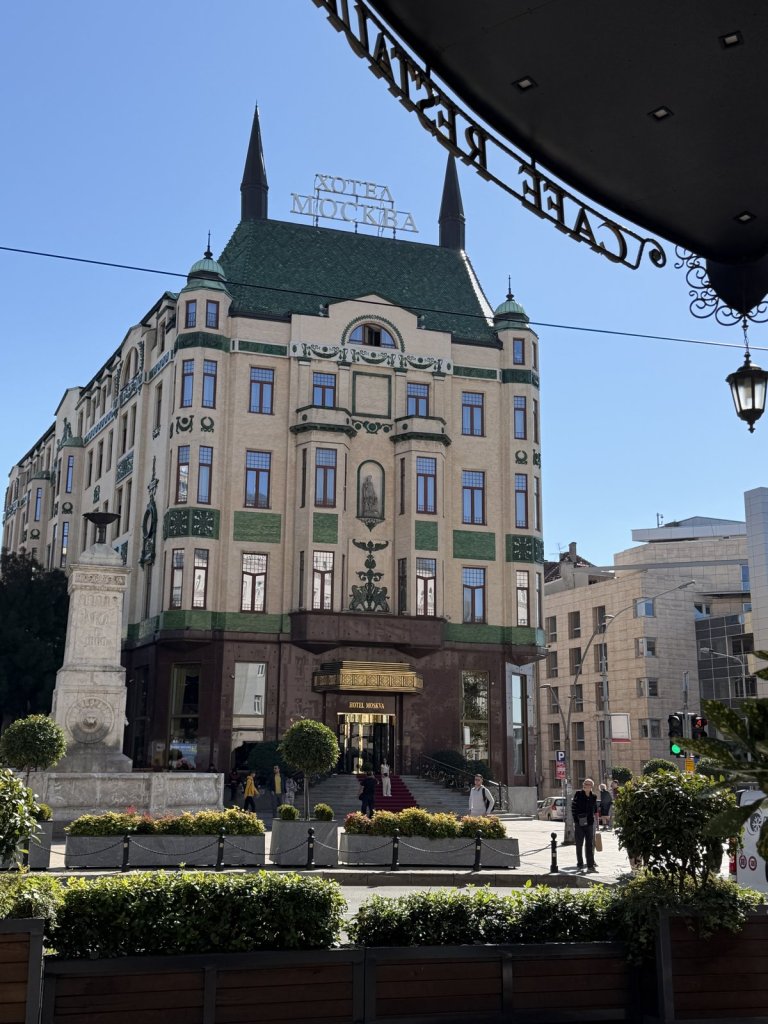 The green-roofed Hotel Moskva on Terazije square under a clear blue sky
